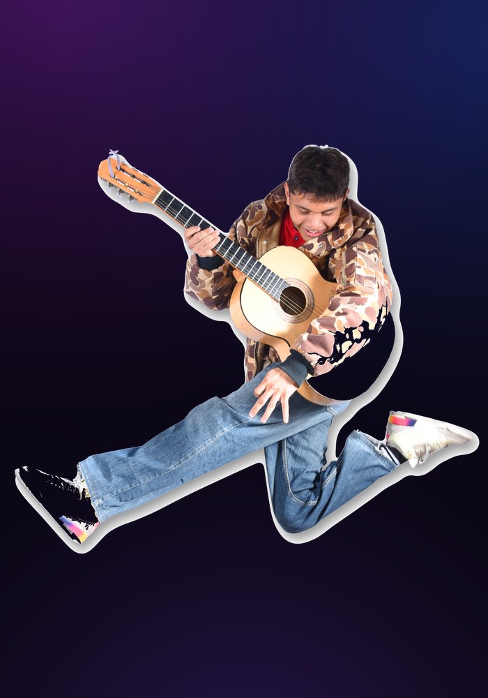 Estudiante de DEART tocando guitarra con energía